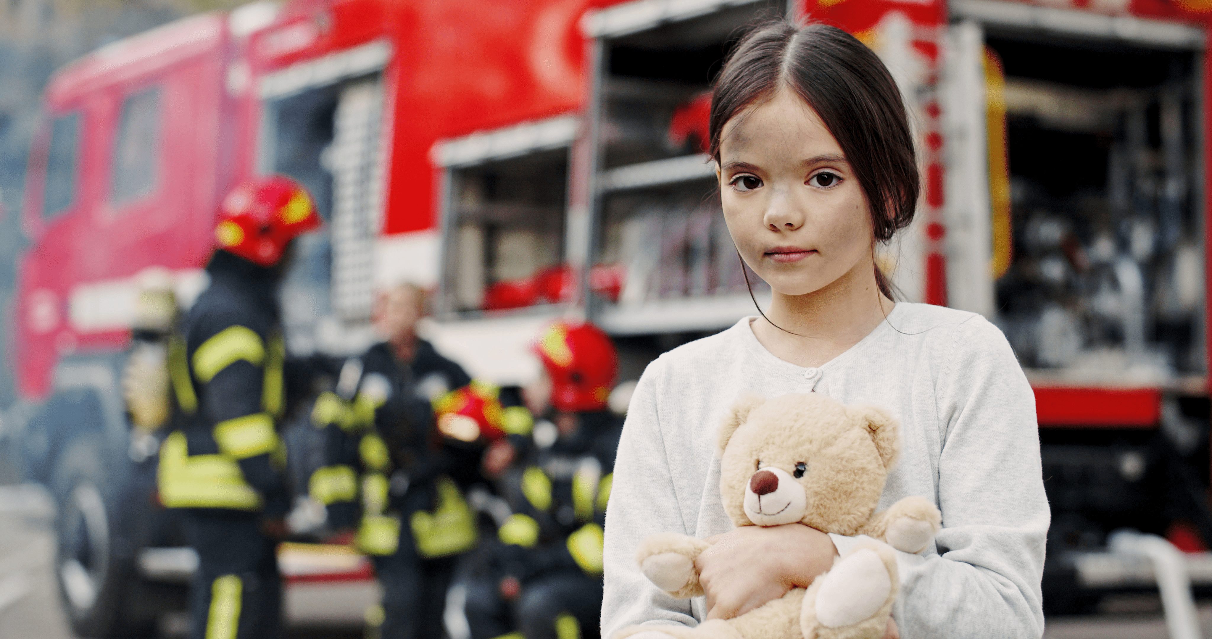 ChildByFireTruck Child Standing By Fire Truck After Home Fire
